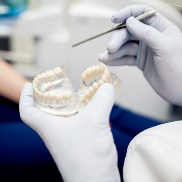 What are the economic effects of poor dental health?