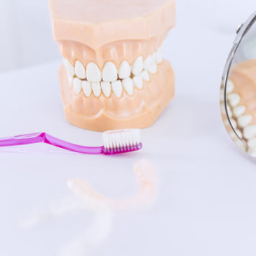 Planning to opt for artificial teeth? Here’re some pros and cons of dentures