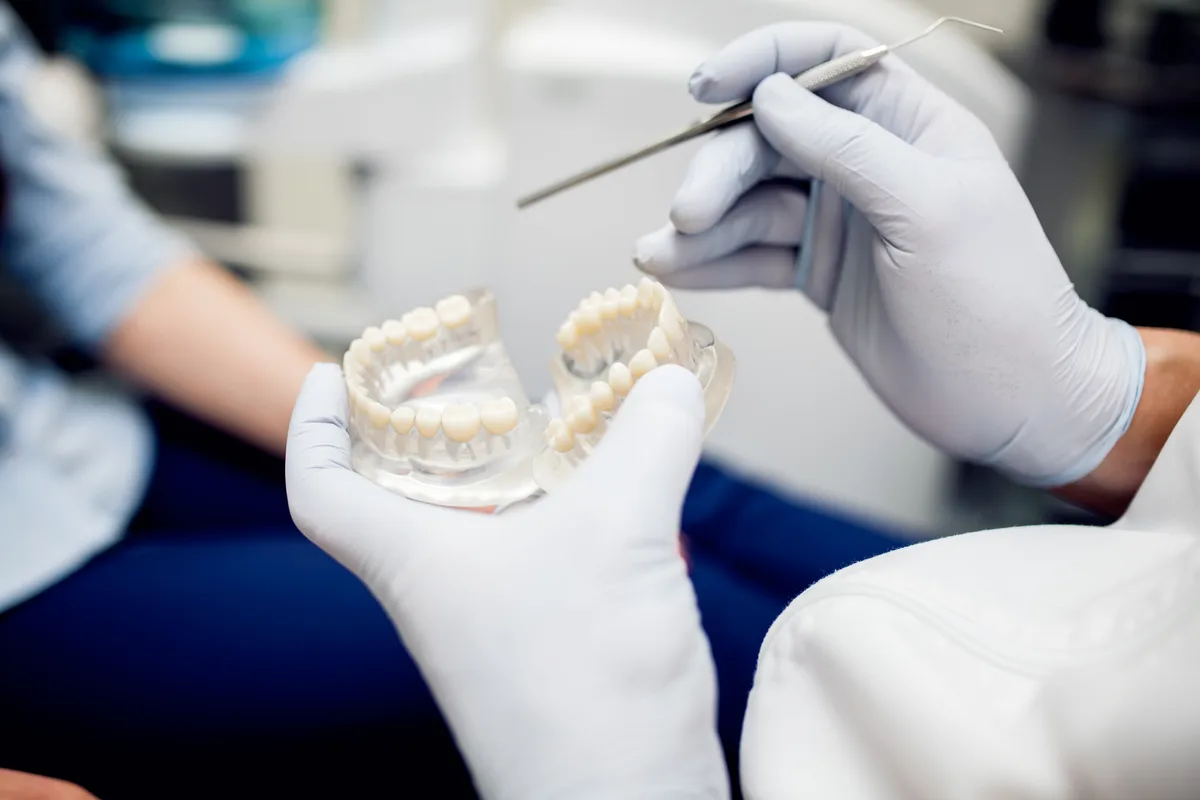 What are the economic effects of poor dental health?