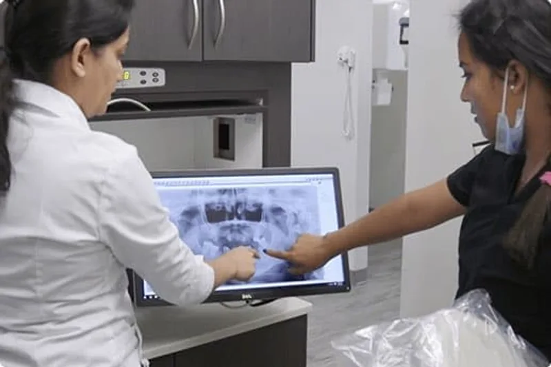 Dentist and team reviewing digital dental X-rays at TruCare Dentistry